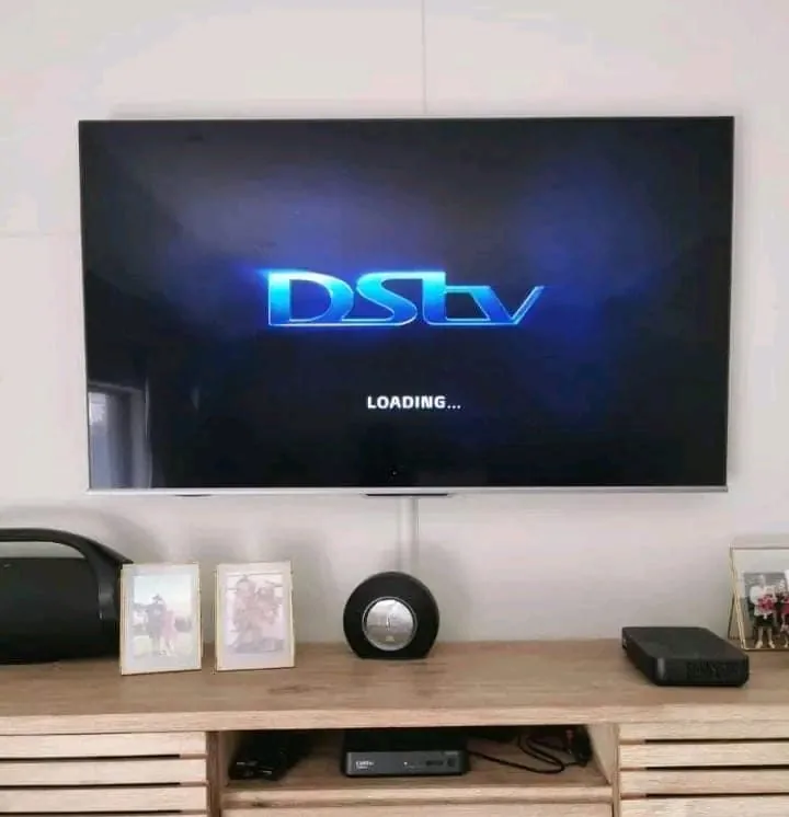 Flat-screen TV neatly wall-mounted with concealed cabling